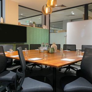meeting room with square table and 12 chairs