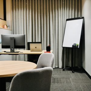 Consulting Room with desk screen and meeting table use whiteboard and tv with screen sharing for client meetings and presentations