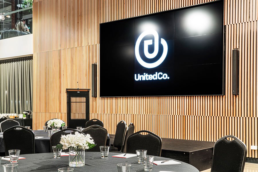 United Co offer cabaret style venue hire space with stage and video wall