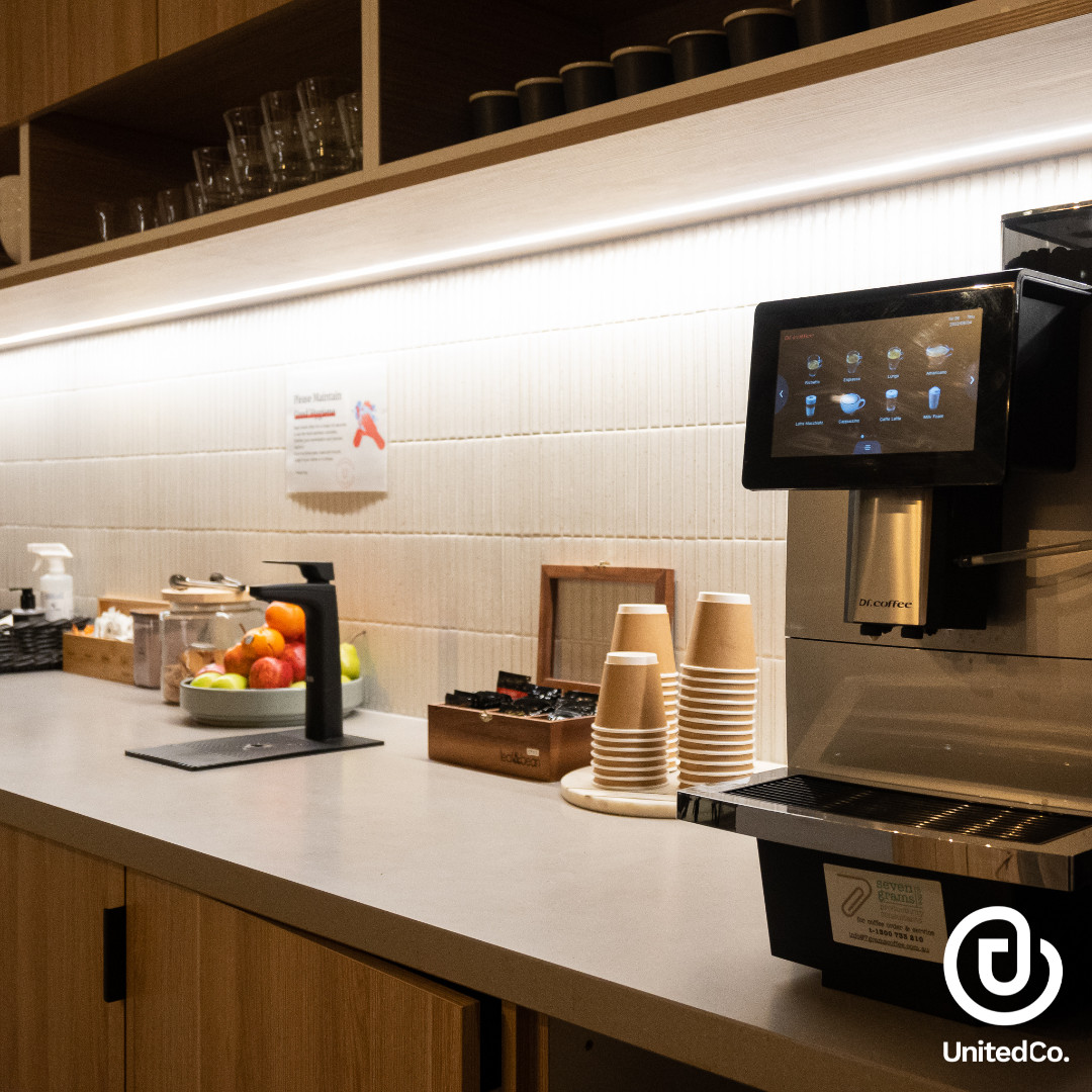 United Co. kitchen area coffee and tea station, biscuits and daily fresh fruits. 