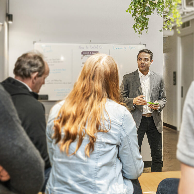 Group of people having a meeting at UnitedCo.